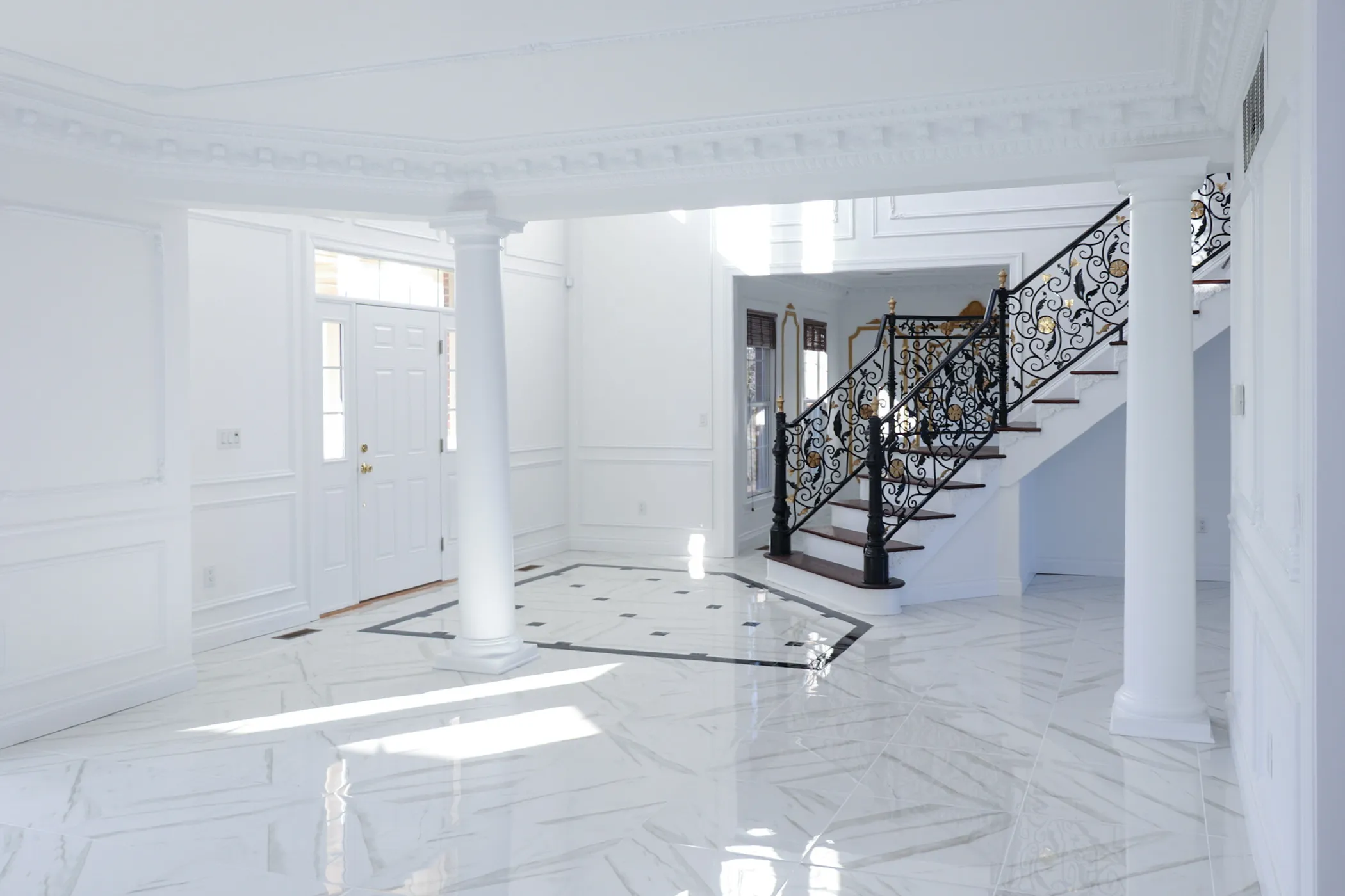 Homepage image: a renovated foyer with staircase